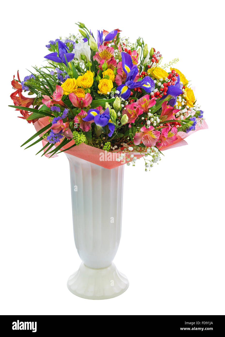 Delicate beautiful bouquet of roses, iris, alstroemeria, nerine and other flowers with colored packaging in vase solated on whit Stock Photo