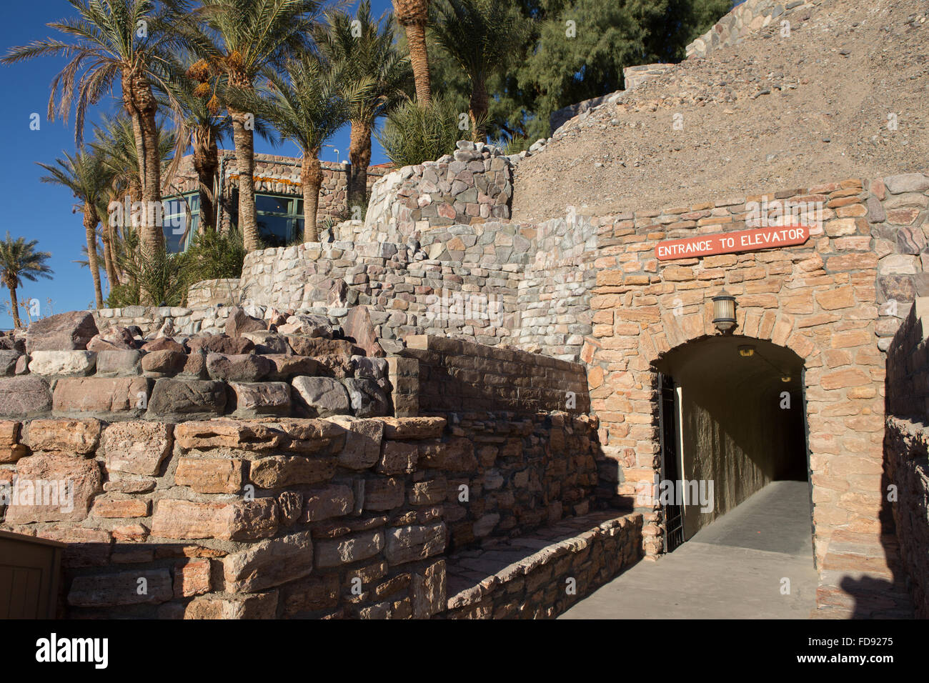 Entrance tunnel from parking lot under the Furnace creek inn Death Valley California. leading to the elevators and hotel lobby. Stock Photo