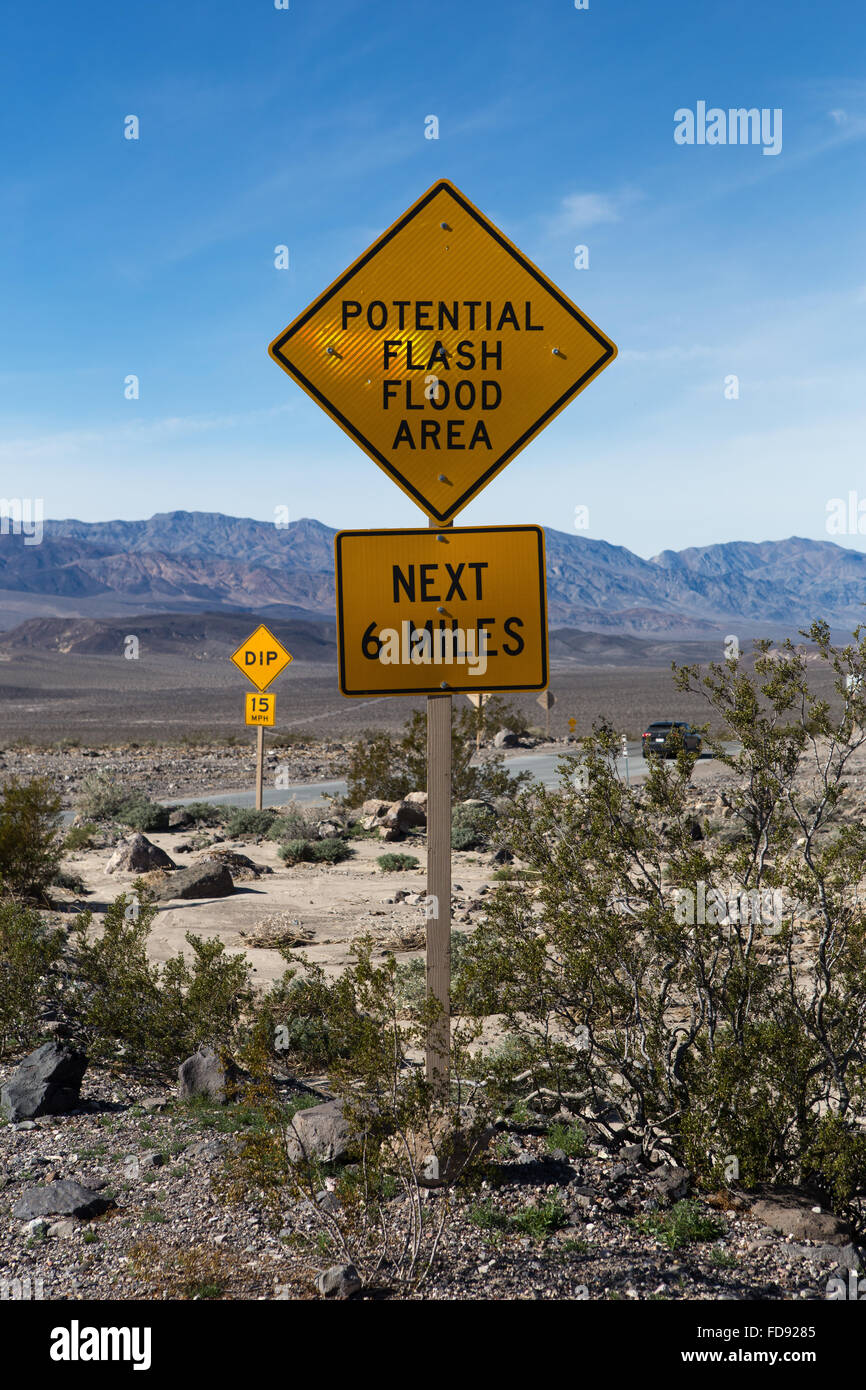 Flash flood warning signs aon the roadside in Death Valley California warning visitors of potential flooding danger Stock Photo