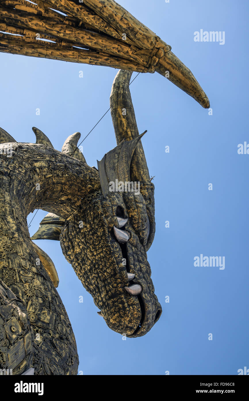 metal statue of the dragon on background of the blue sky Stock Photo