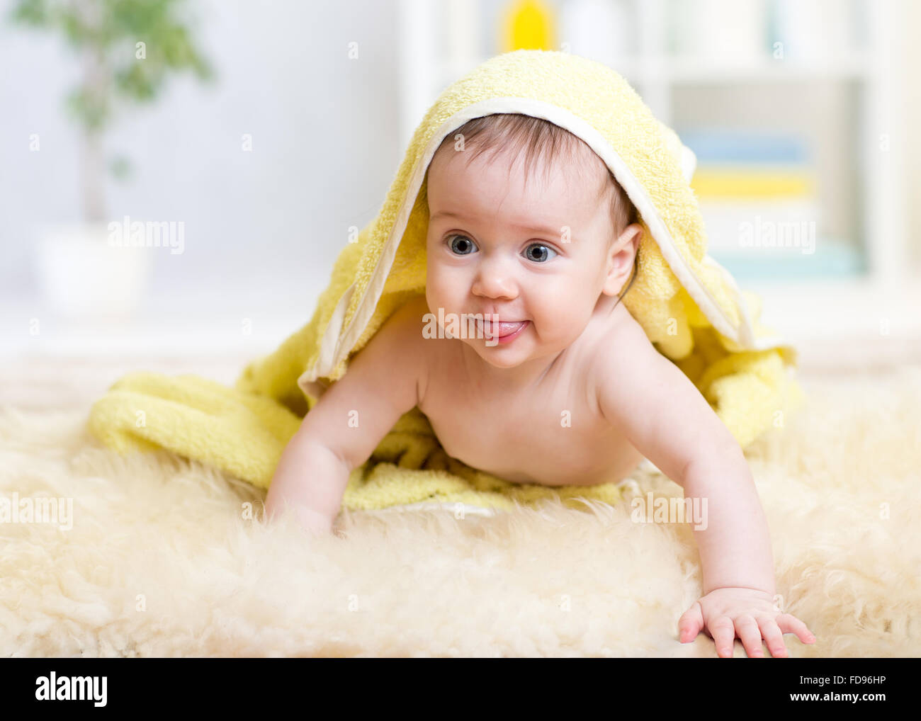 Smiling baby after shower with towel on head Stock Photo Alamy