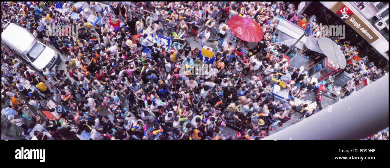 Panoramic View Of People Celebrating Water Festival In City Stock Photo