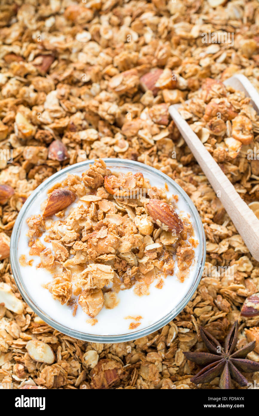 Homemade granola with almonds and glass of fresh yogurt. Top view
