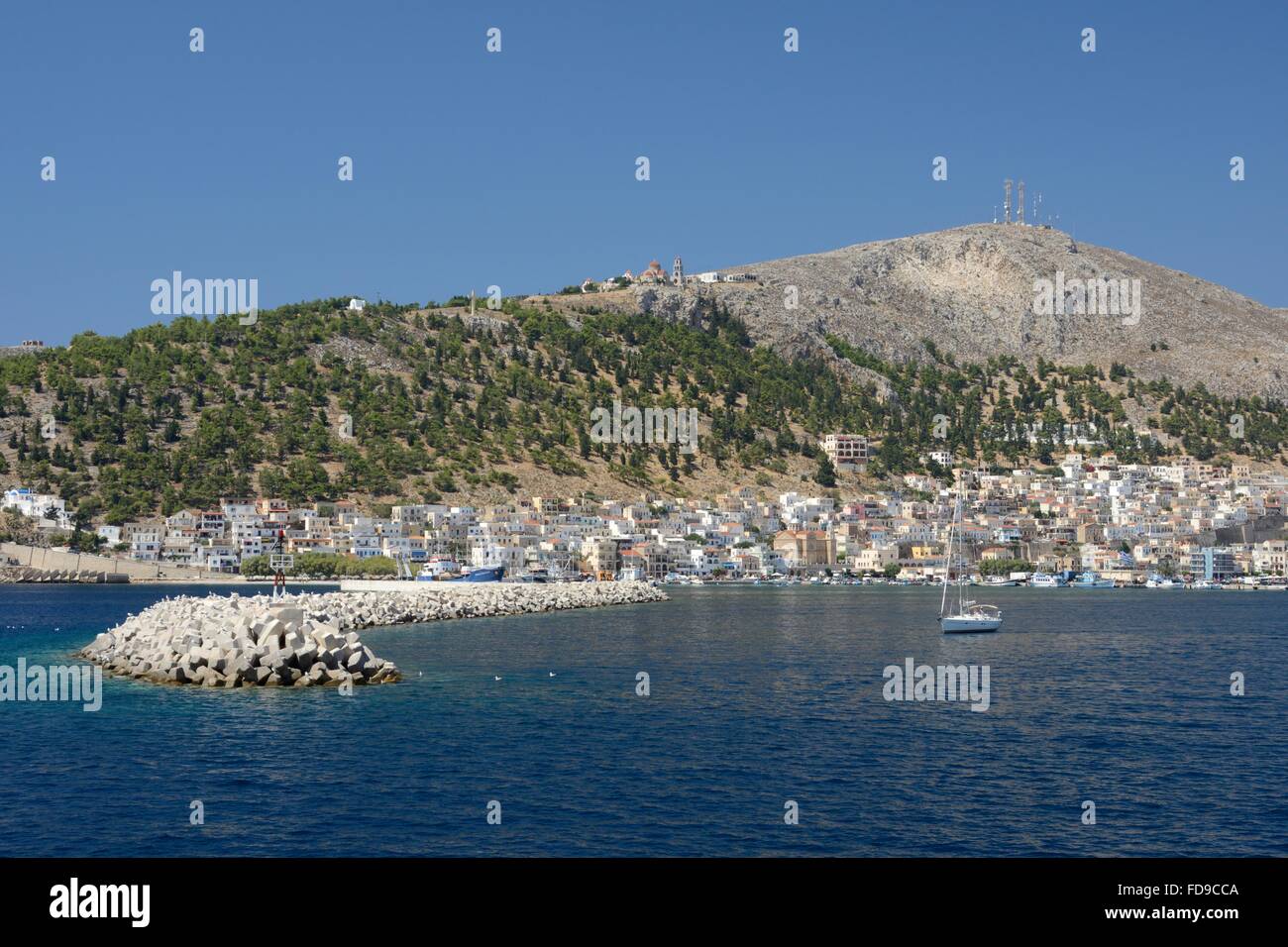 Pothia town and harbour viewed from the sea, Kalymnos, Dodecanese Islands, Greece. Stock Photo