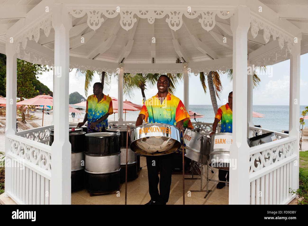Steel drummers play in pagoda on beach, St Lucia,  Lesser Antilles, Caribbean Stock Photo