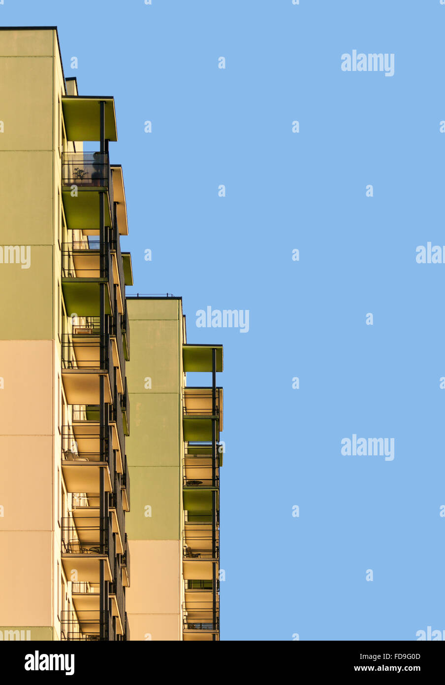 Abstract picture of modern apartment building with balconies against blue sky Stock Photo