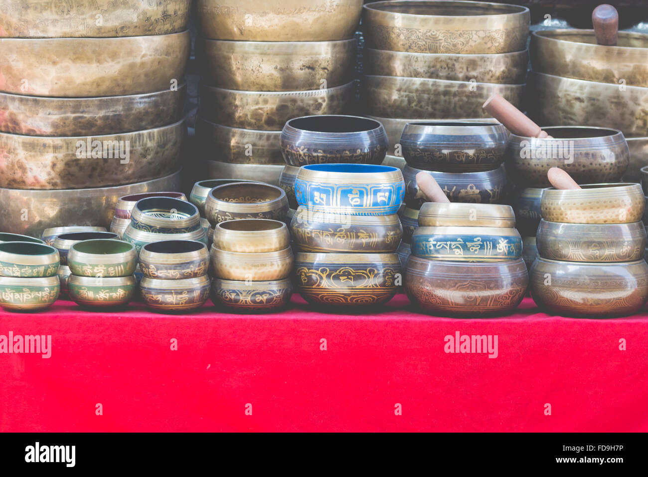 Several singing bowls displayed at a market in Kathmandu, Nepal Stock