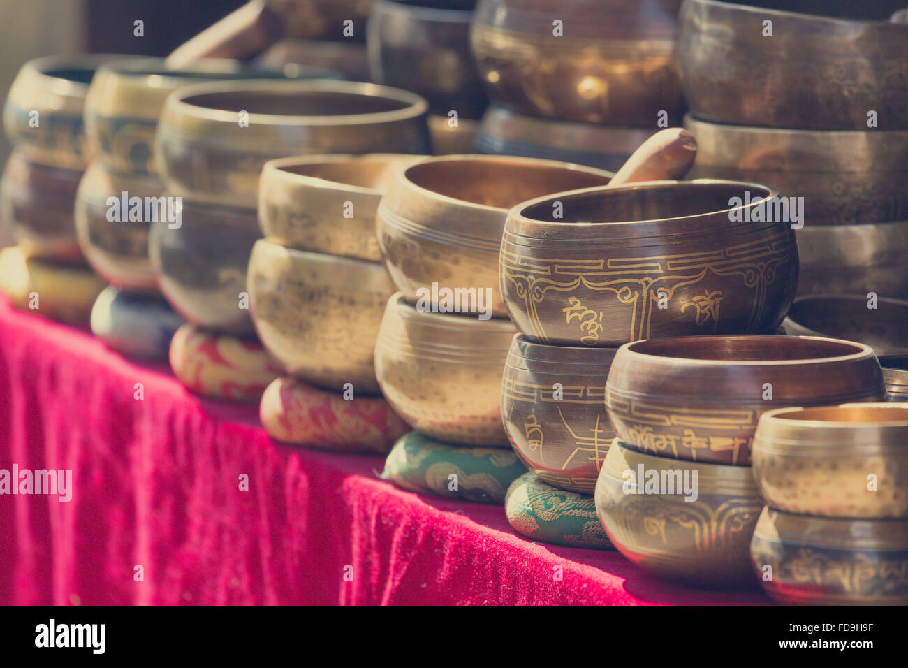 Several singing bowls displayed at a market in Kathmandu, Nepal Stock