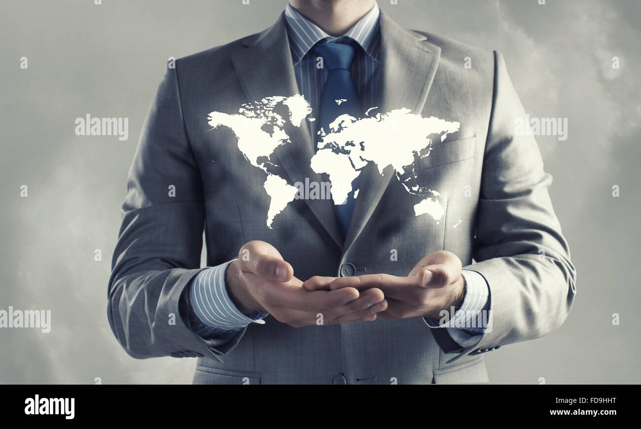 Close up of businessman holding world map in hands Stock Photo - Alamy
