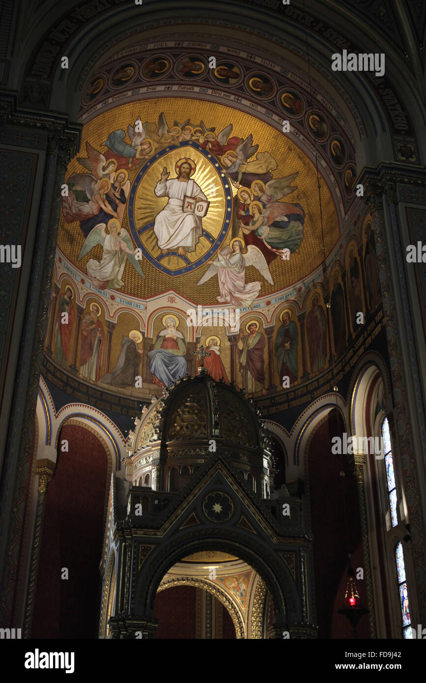 Jesus Christ surrounded by Angels and the Virgin Mary with Saints Cyril and Methodius and Twelve Apostles. Mural painting over the ciborium in the presbytery of the Church of Saints Cyril and Methodius on Karlinske square in Karlin district in Prague, Czech Republic. Stock Photo