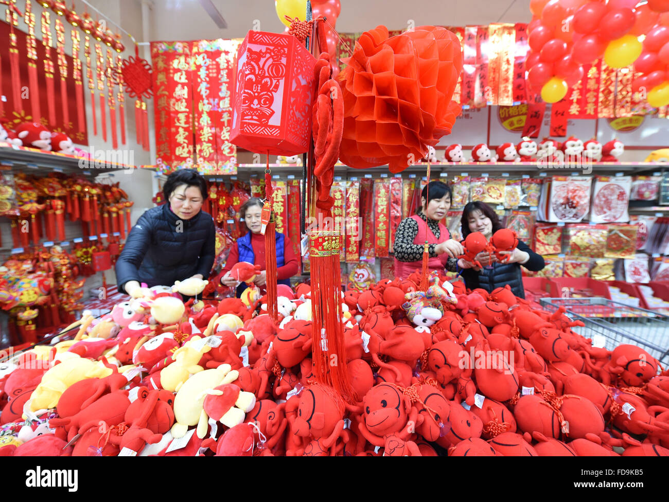 Nanjing, Many supermarkets and shopping malls in Nanjing opened special shopping area for commodities for Spring Festival. 8th Feb, 2016. Local residents select ornaments for the coming Spring Festival at a supermarket in Nanjing, capital of east China's Jiangsu Province, Jan. 29, 2016. Many supermarkets and shopping malls in Nanjing opened special shopping area for commodities for Spring Festival, which will fall on Feb. 8, 2016. © Sun Can/Xinhua/Alamy Live News Stock Photo