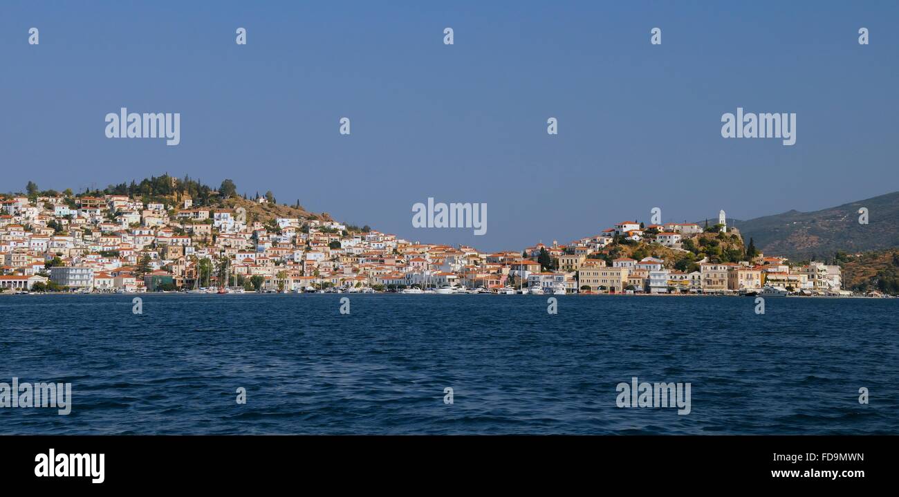 Poros town and harbour viewed from the sea, Poros island, Attica, Peloponnese, Greece. Stock Photo