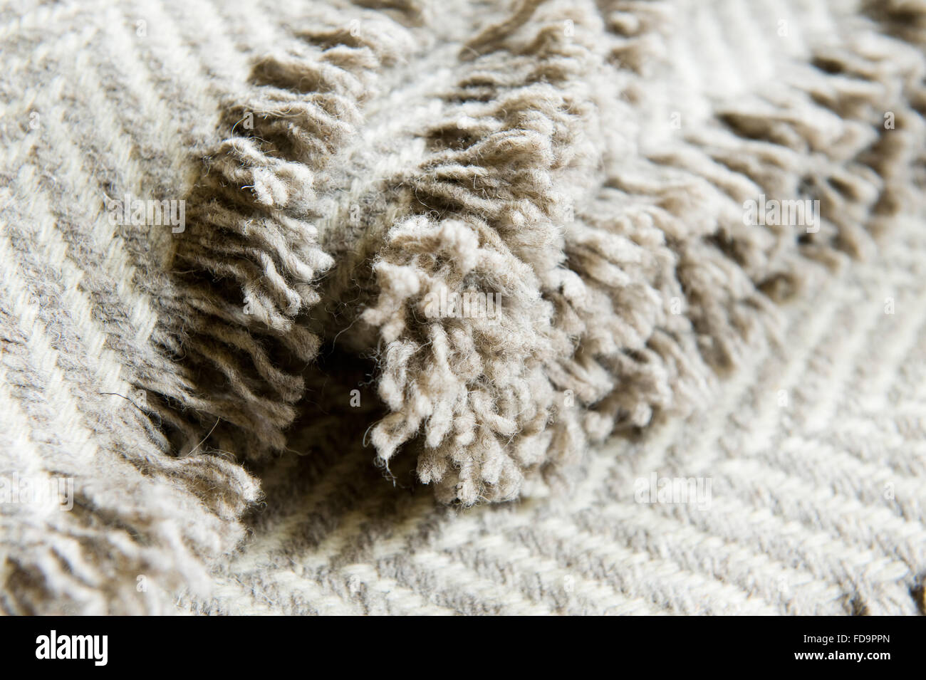 Fringed edge of woolen blanket Fringed edge of woolen blanket Stock Photo
