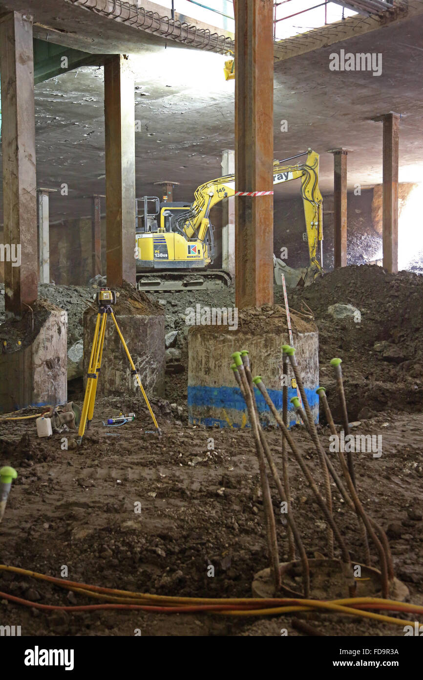 The excavation of a basement on a large, commercial development in central London, UK using the Top-Down construction method. Stock Photo