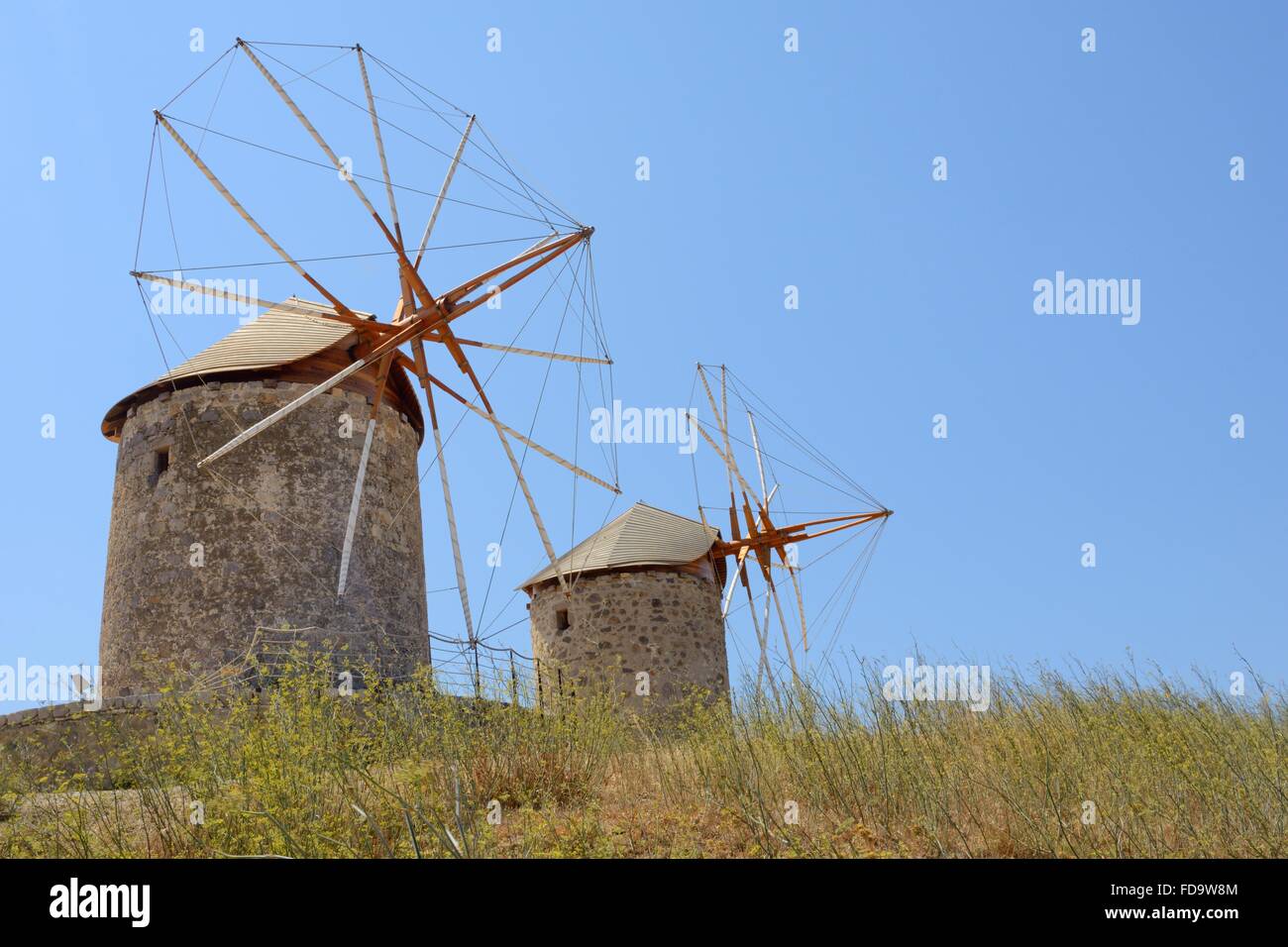 Restored windmills of the Monastery of St. John the Theologian, Chora, Patmos, Dodecanese Islands, Greece. Stock Photo