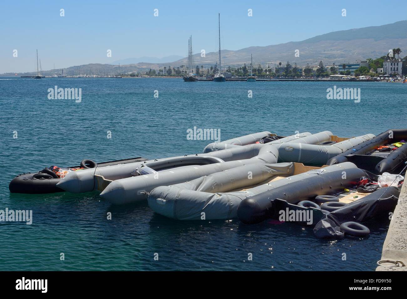 Dinghies moored on the quayside at Kos town harbour used by migrants on the crossing from Turkey, Kos, Greece. Stock Photo
