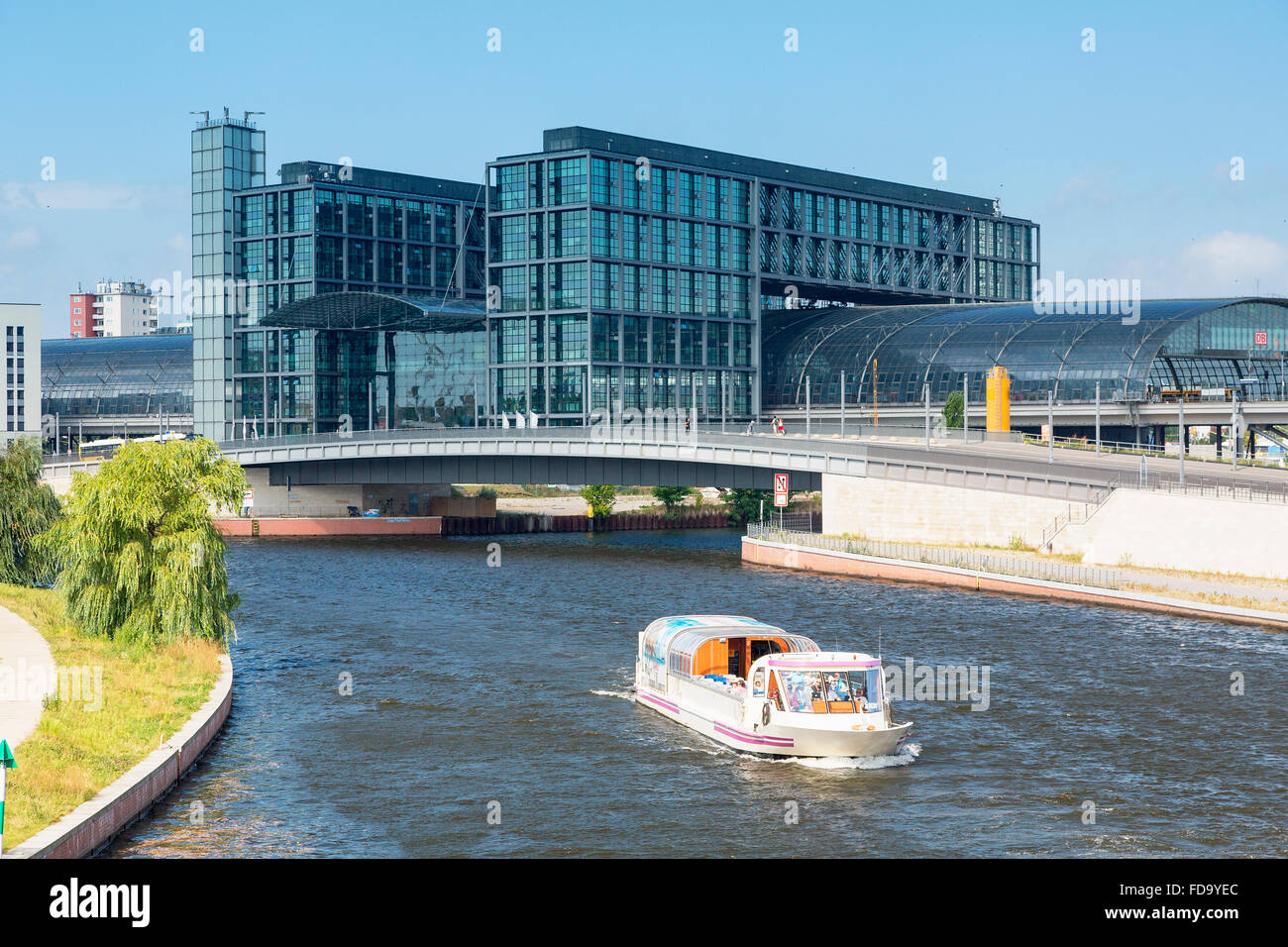 Europe, Germany, Berlin, A tour boat on the Spree River, on the background the Berlin Hauptbahnhof (Central Station) Stock Photo