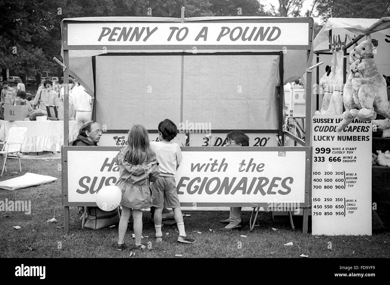 Children at an old-fashioned stall raising money for charity at a community event, the Lion's Carnival in Hove Park, early 1990s Stock Photo