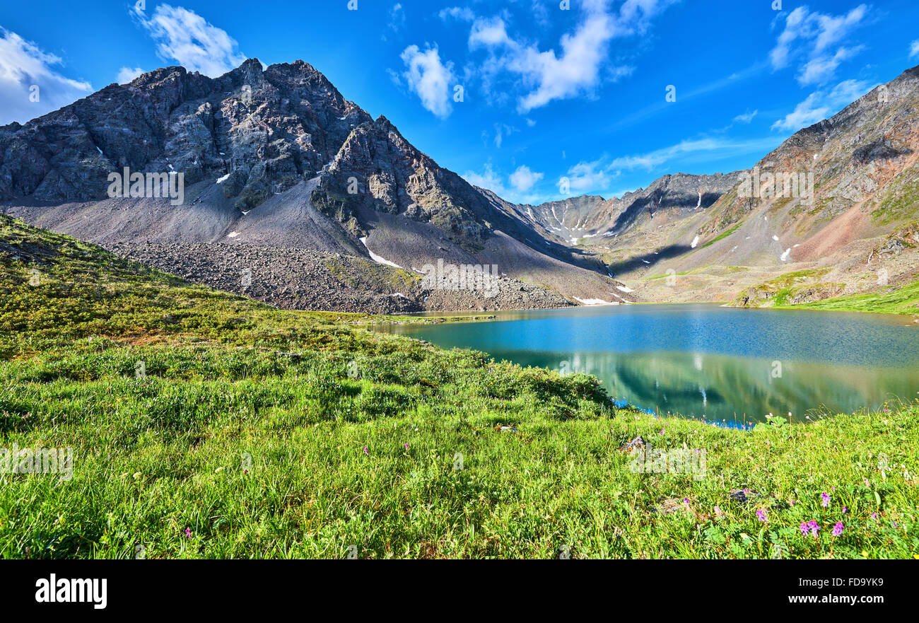 Mountain range near the lake and alpine meadow. East Sayan. Buryatiya Stock Photo