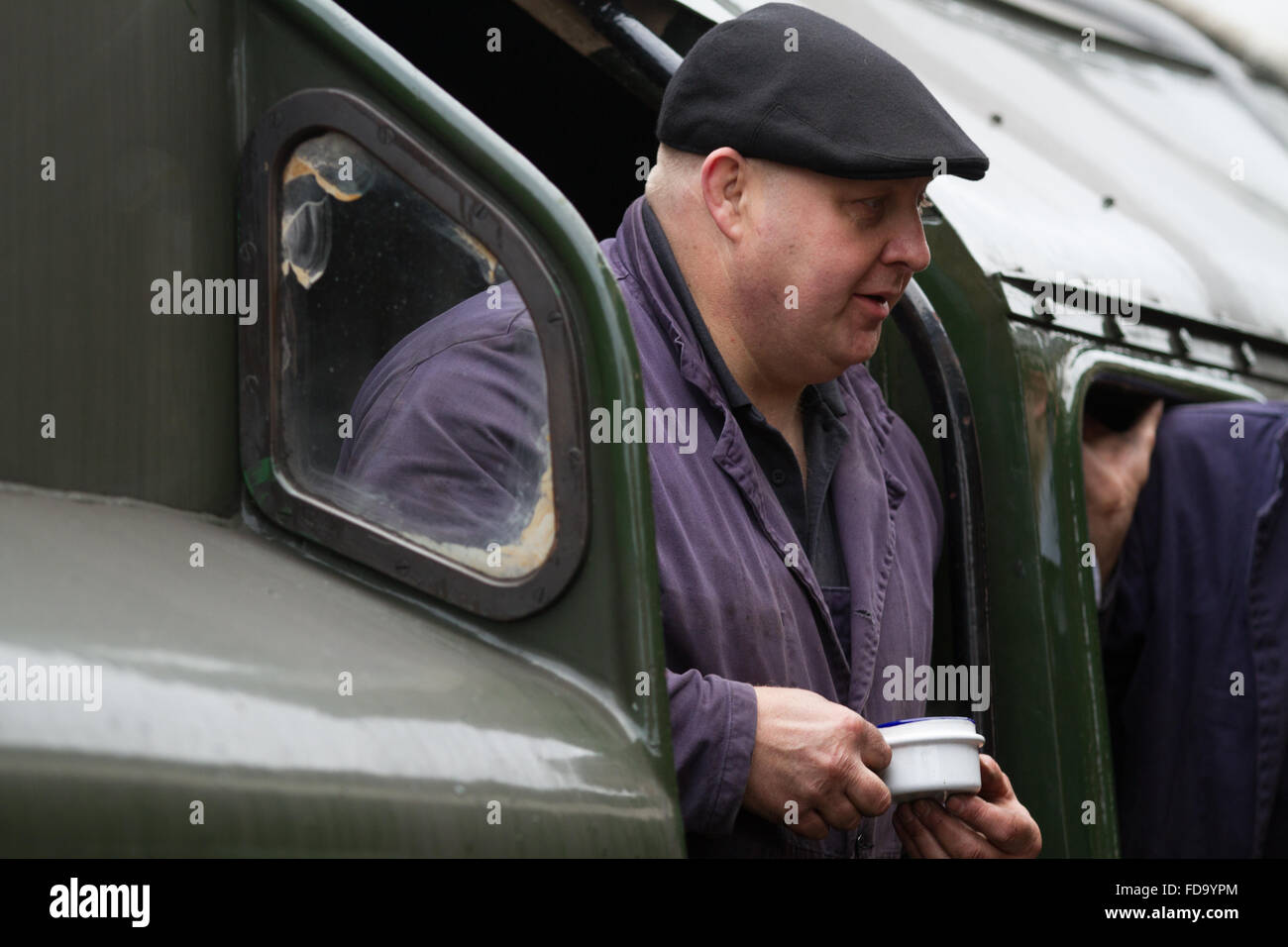 A driver pauses for refreshment at Rothley station, Great Central Railway. Stock Photo