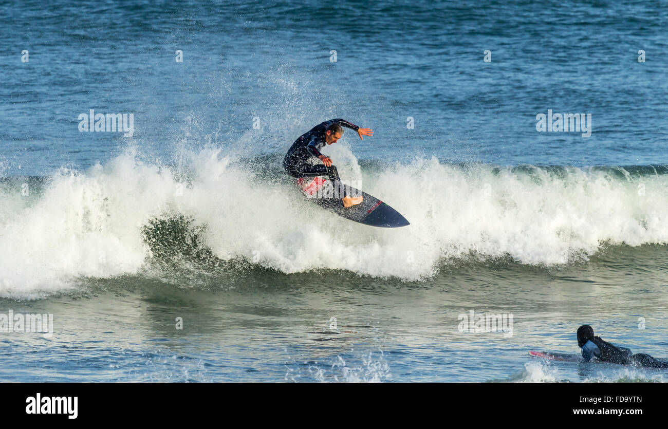 surfer riding crest of wave, Fistral Beach, Cornwall, UK Stock Photo ...