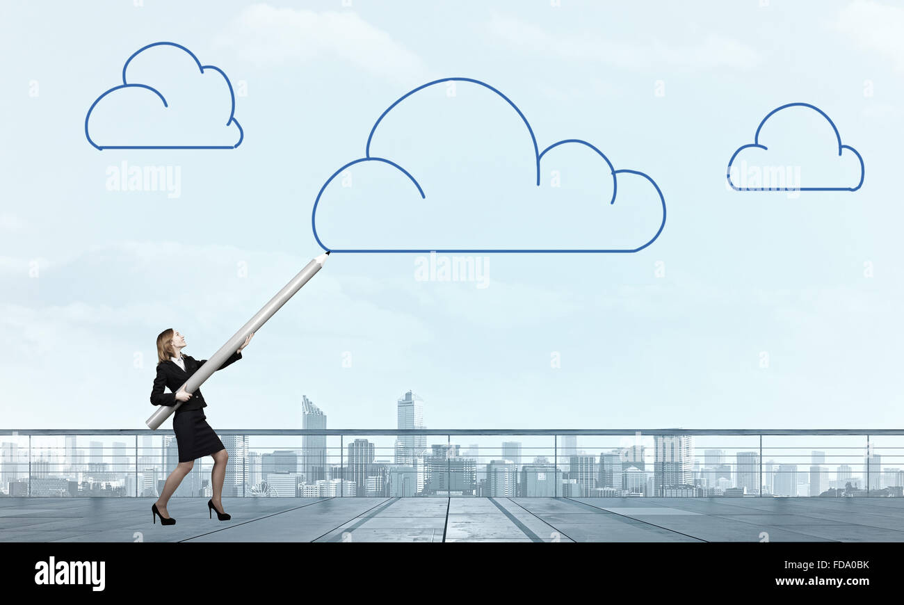 Businesswoman drawing cloud in sky with huge pencil Stock Photo - Alamy