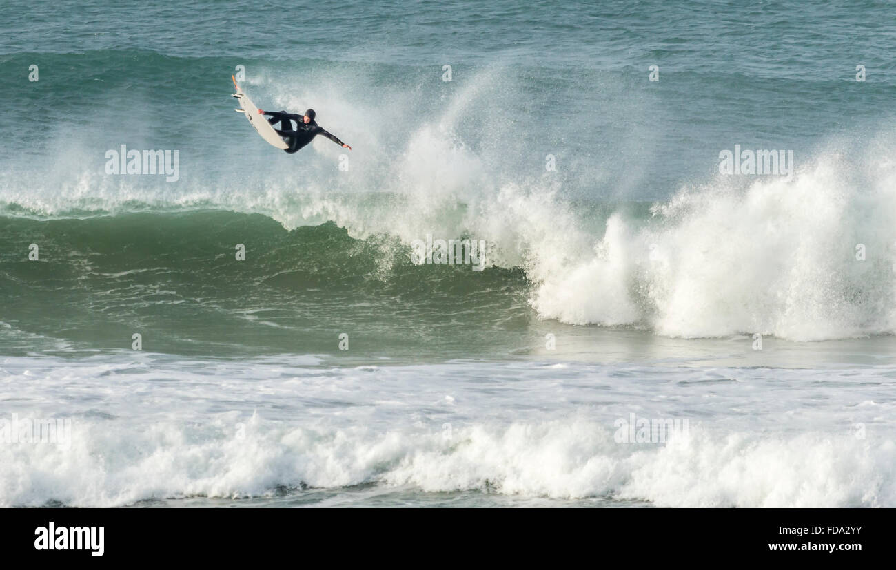 Wave jumping in surf, Fistral Beach, Cornwall, UK Stock Photo Alamy