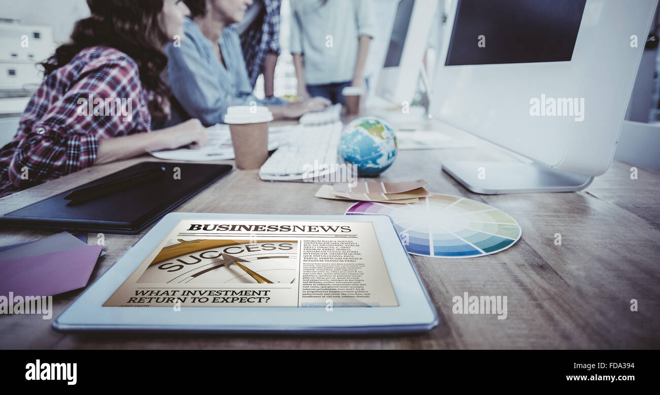 Composite image of business newspaper Stock Photo