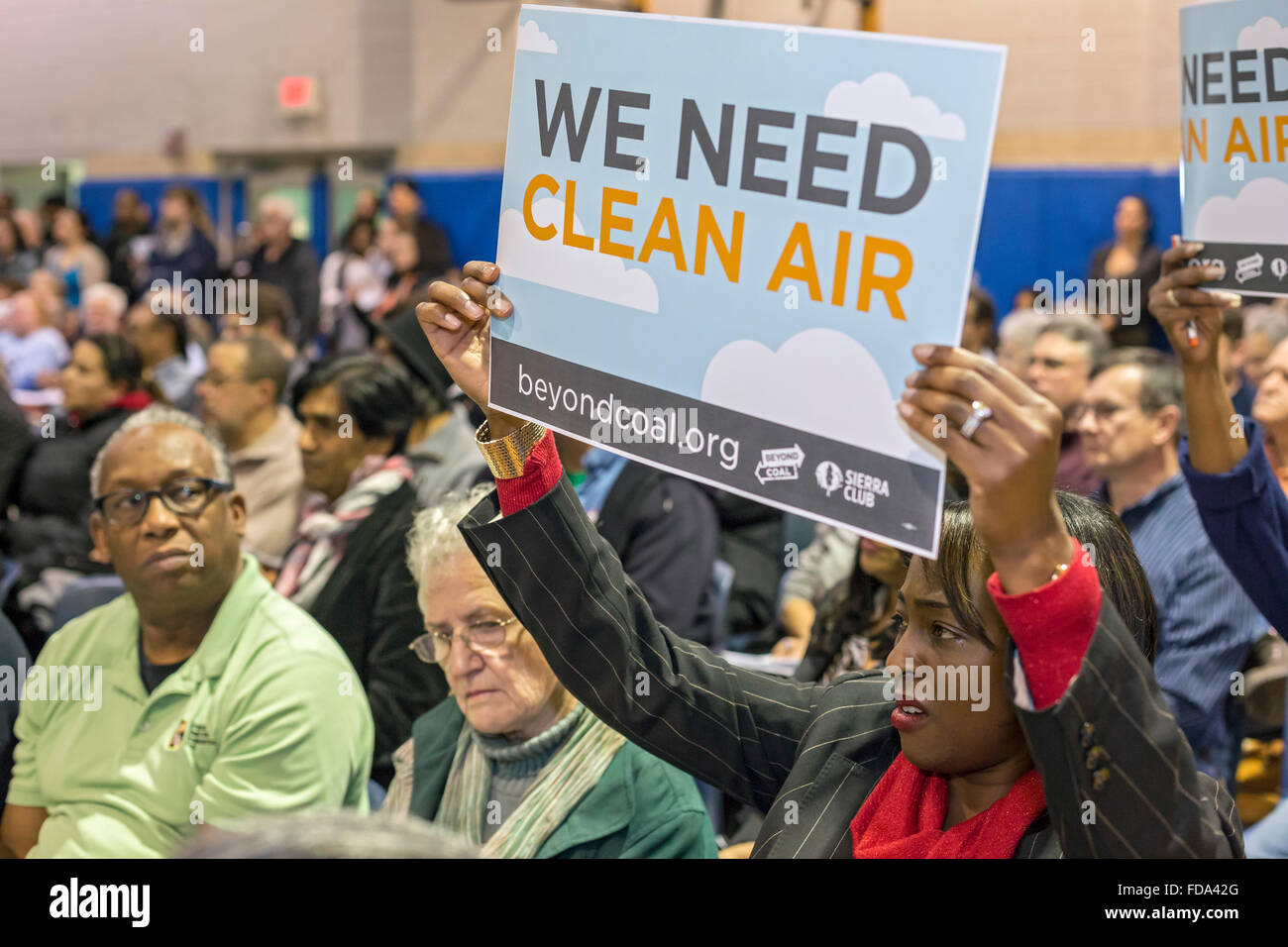 Detroit, Michigan, USA. 28th January 2016. Residents of the neighborhood near Marathon Petroleum's oil refinery attend a Detroit city council public hearing, opposing a proposal to allow the refinery to discharge higher quantities of sulfur dioxide and other pollutants. Marathon says it needs the change to be able to produce lower-sulfur gasoline. The low-income area, zip code 48217, is already the most polluted in Michigan. Credit:  Jim West/Alamy Live News Stock Photo