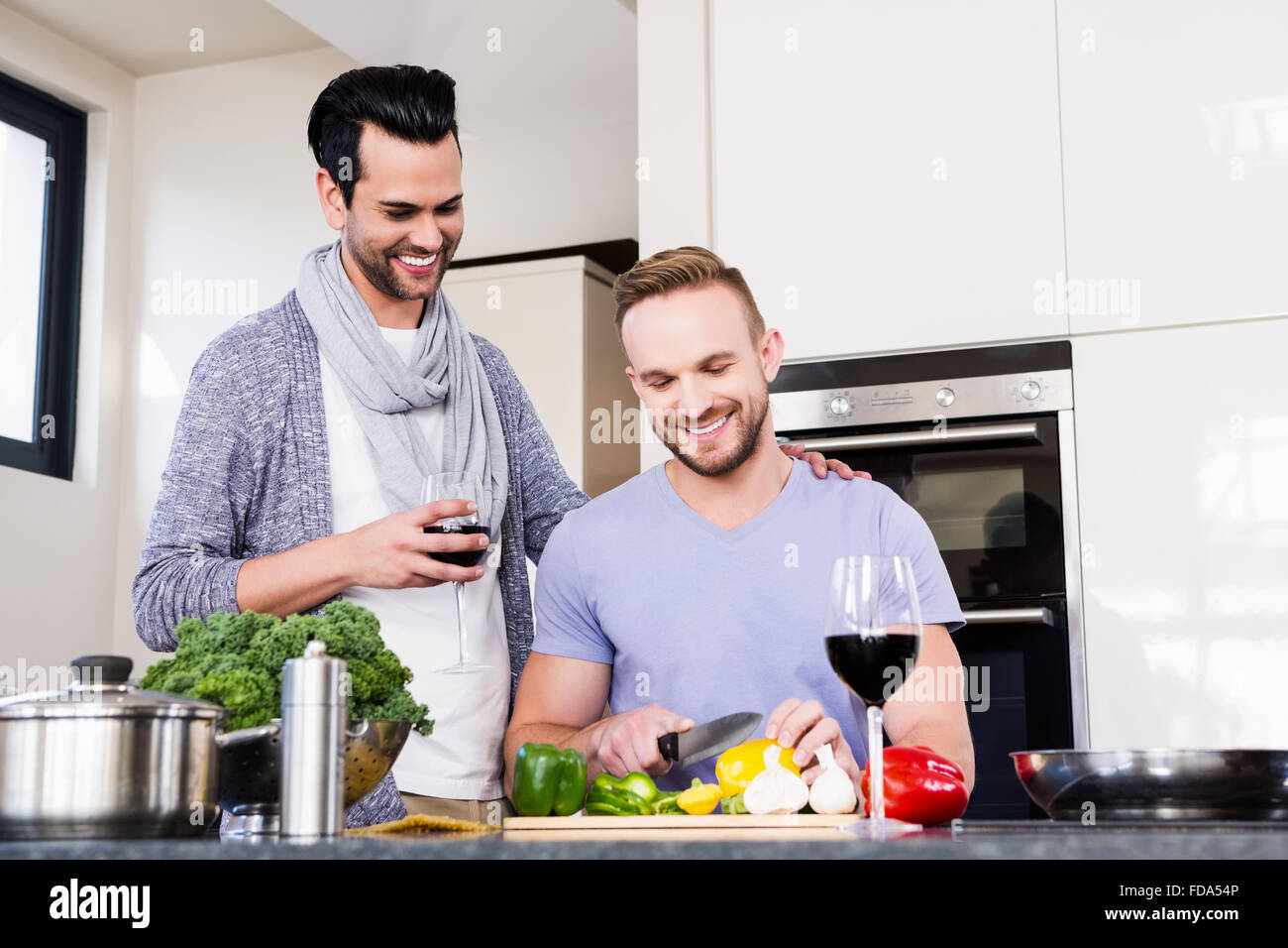Gay couple cooking together hires stock photography and images Alamy