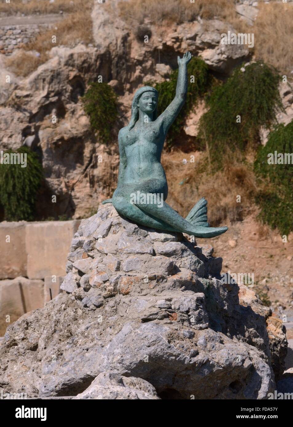 Mermaid statue on the Quay at Pothia town harbour, Kalymnos, Dodecanese Islands, Greece. Stock Photo