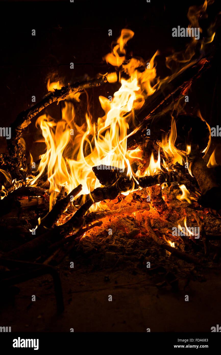 Wood fire burning in a chimney with flames burning logs and branches Stock Photo Alamy
