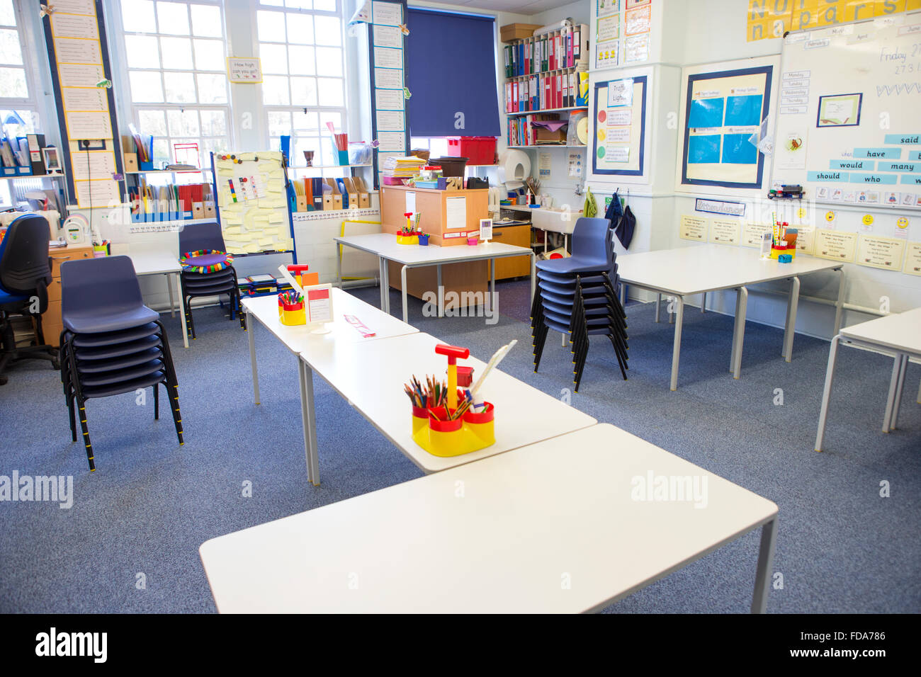 A horizontal image of an empty primary school classroom. The setting is typically British. Stock Photo