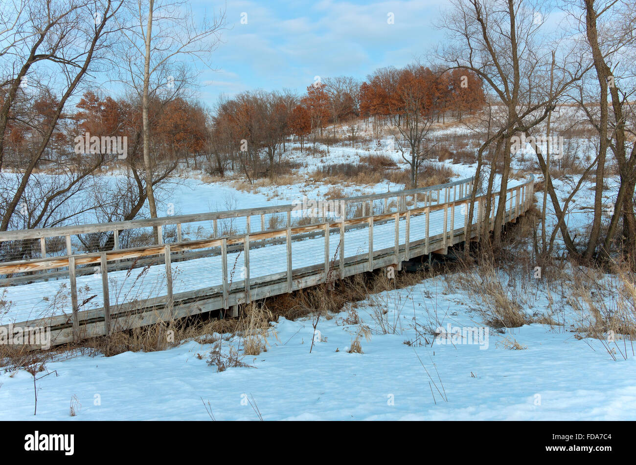 lebanon hills regional park at edge of mcdonough lake with bridge crossing and trail through wooded hills in eagan minnesota Stock Photo