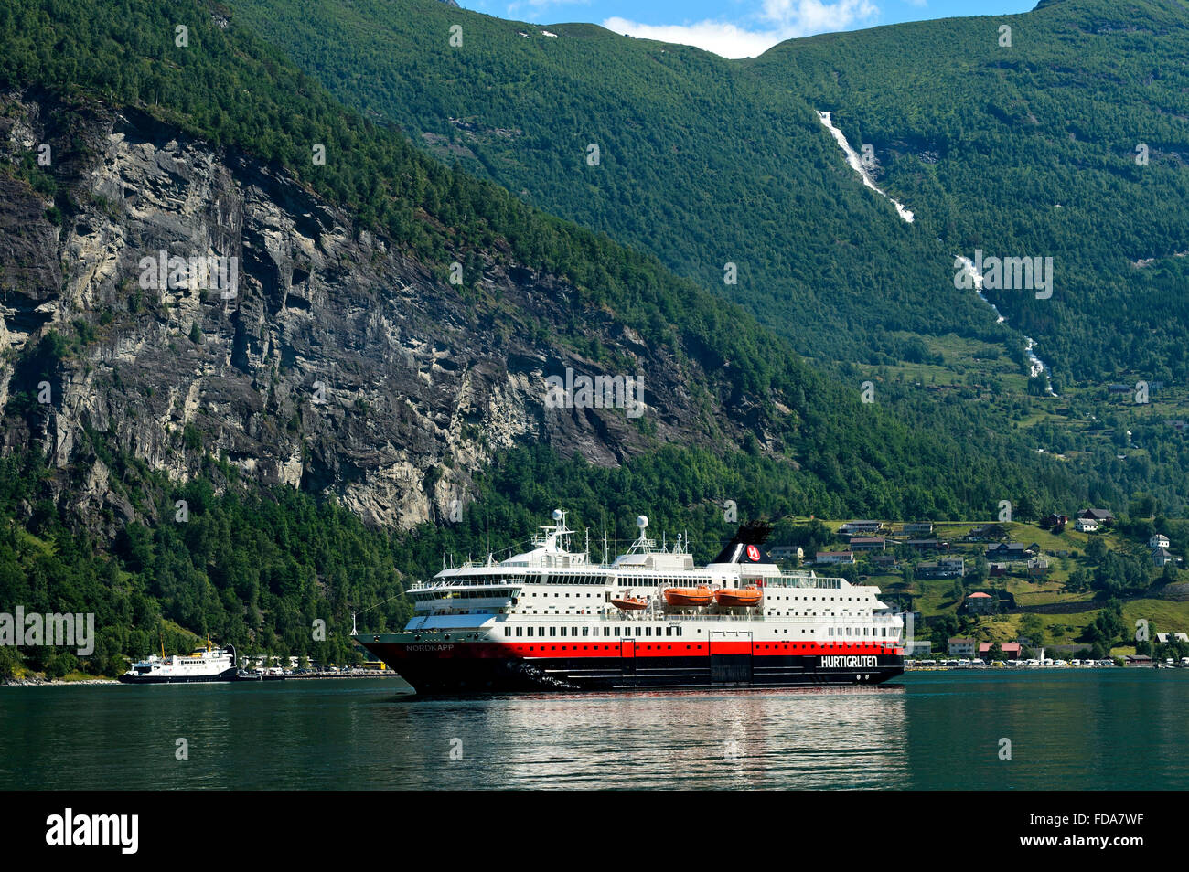 Cruise ship MS Nordkapp of the shipping company Hurtigruten AS in Geirangerfjord, Geiranger, Norway Stock Photo