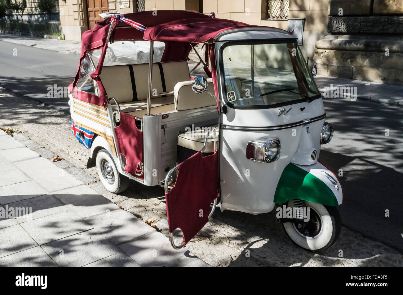 Piaggio Ape 'Trishaw' parked in sunlight road of Palermo, Sicily, Italy Stock Photo
