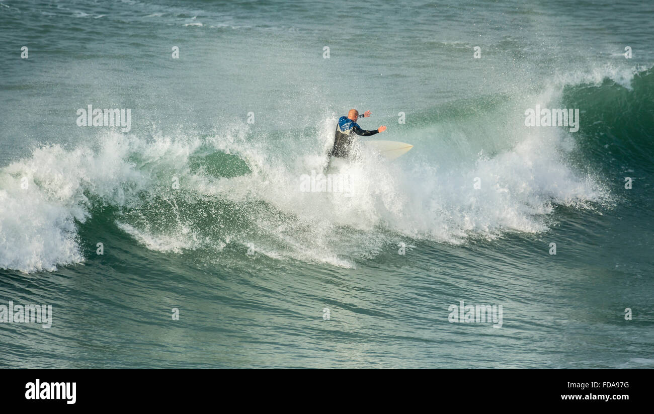 Surfer riding crest of wave, Fistral Beach, Cornwall, UK Stock Photo ...