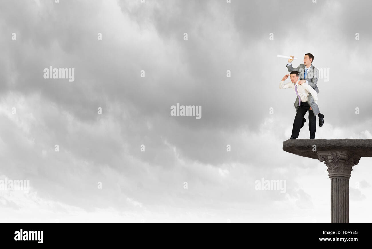 Businessman riding on back of his colleague Stock Photo - Alamy
