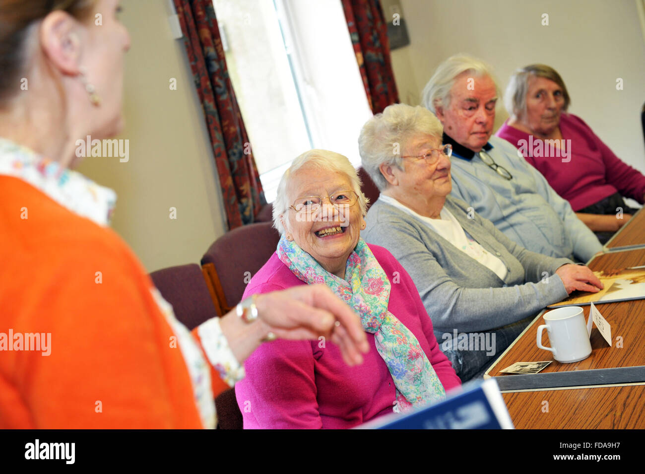 Elderly people take part in a dementia care workshop North Yorkshire UK positive Stock Photo