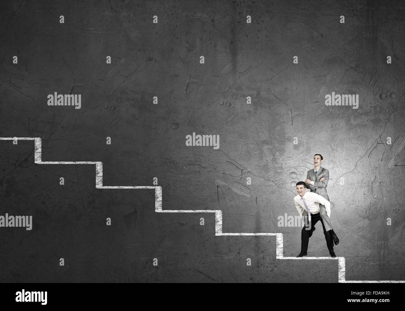 Businessman riding on back of his colleague Stock Photo - Alamy