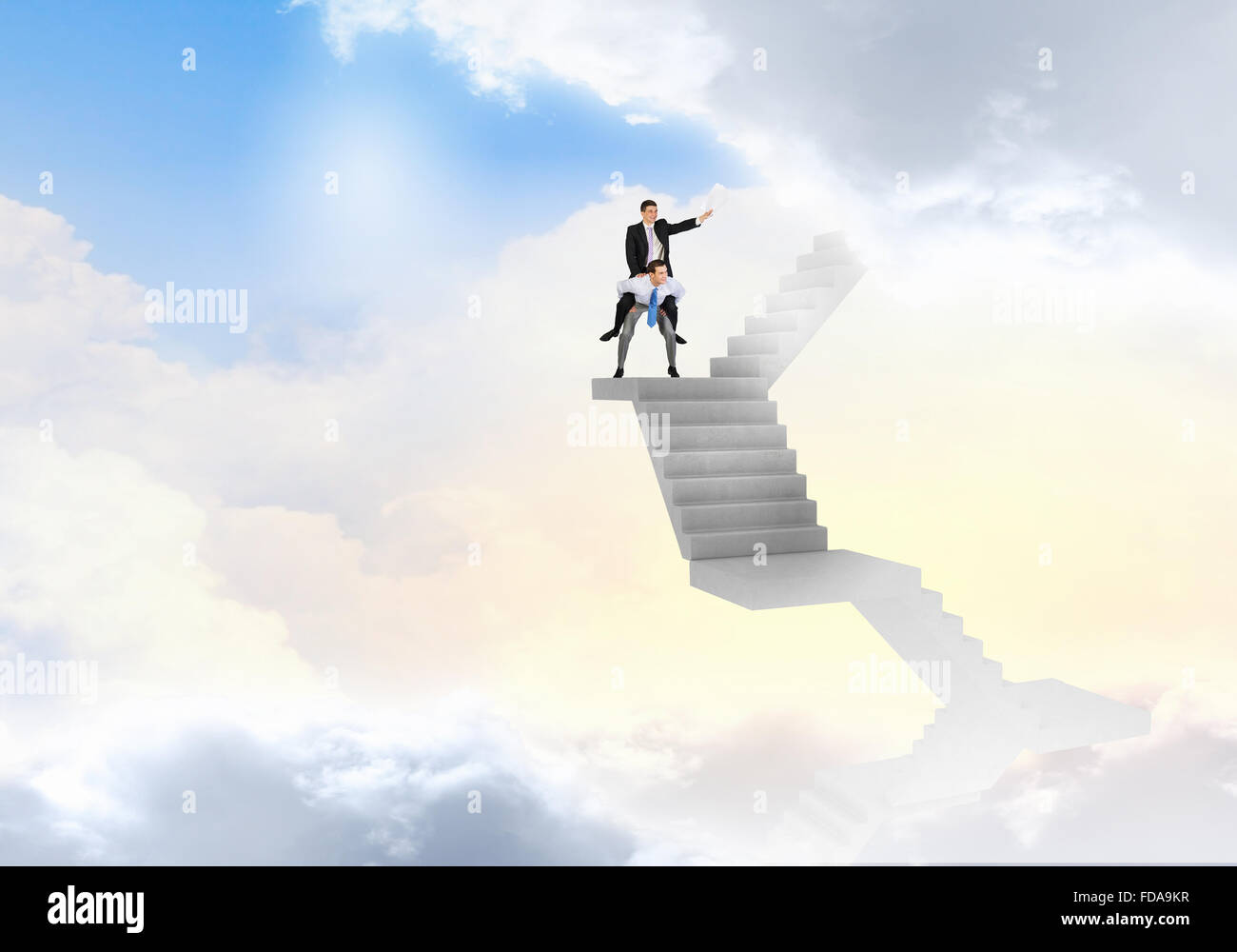 Businessman riding on back of his colleague Stock Photo - Alamy