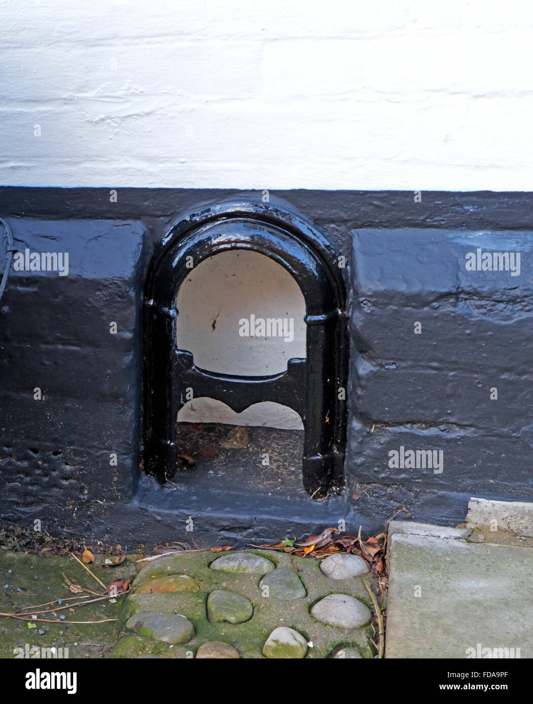 A boot scraper built into a wall in Art Nouveau design. Stock Photo