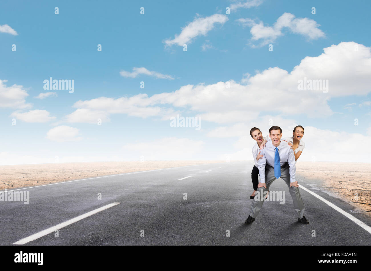 Businesswomen riding on back of colleague businessman Stock Photo - Alamy