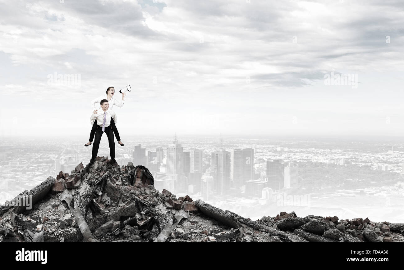 Businesswoman riding on back of her colleague Stock Photo - Alamy