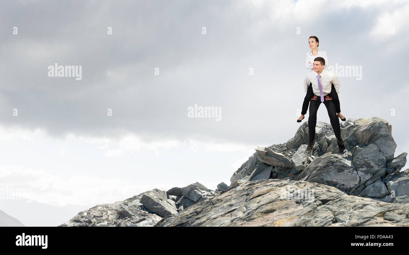 Businesswoman riding on back of her colleague hi-res stock photography ...