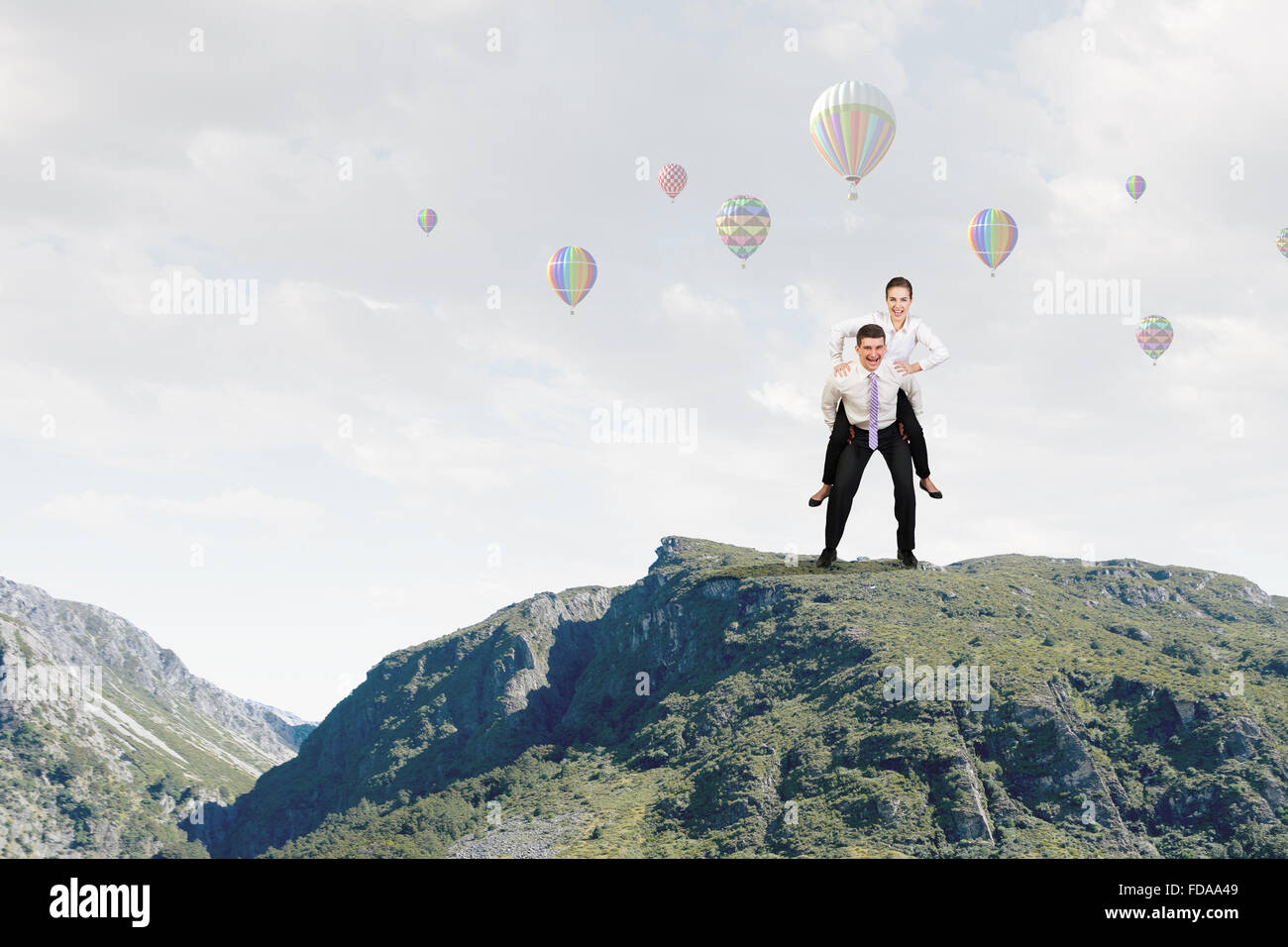 Businesswoman riding on back of her colleague Stock Photo - Alamy