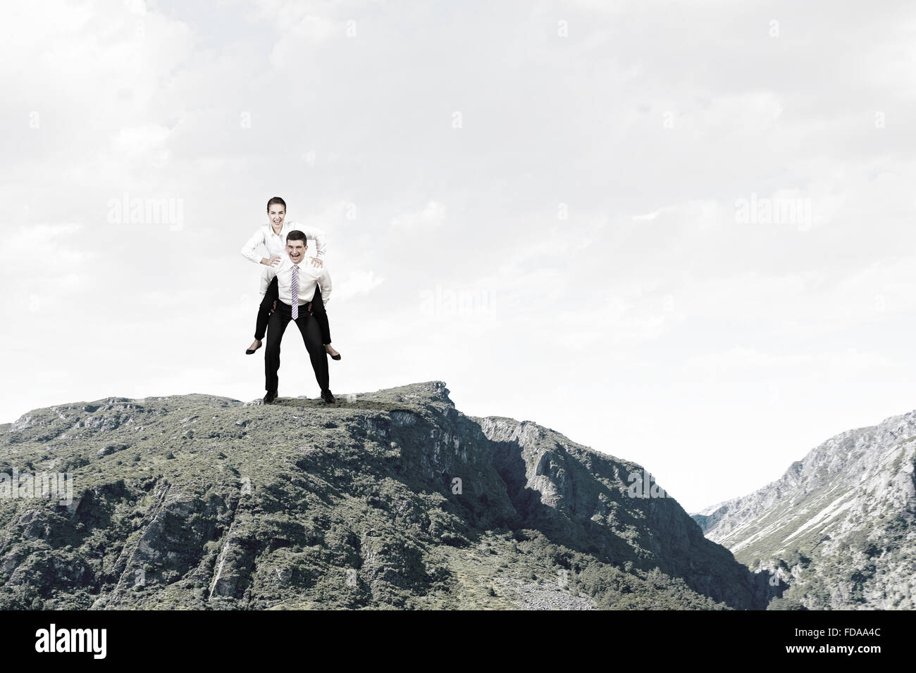Businesswoman riding on back of her colleague Stock Photo - Alamy