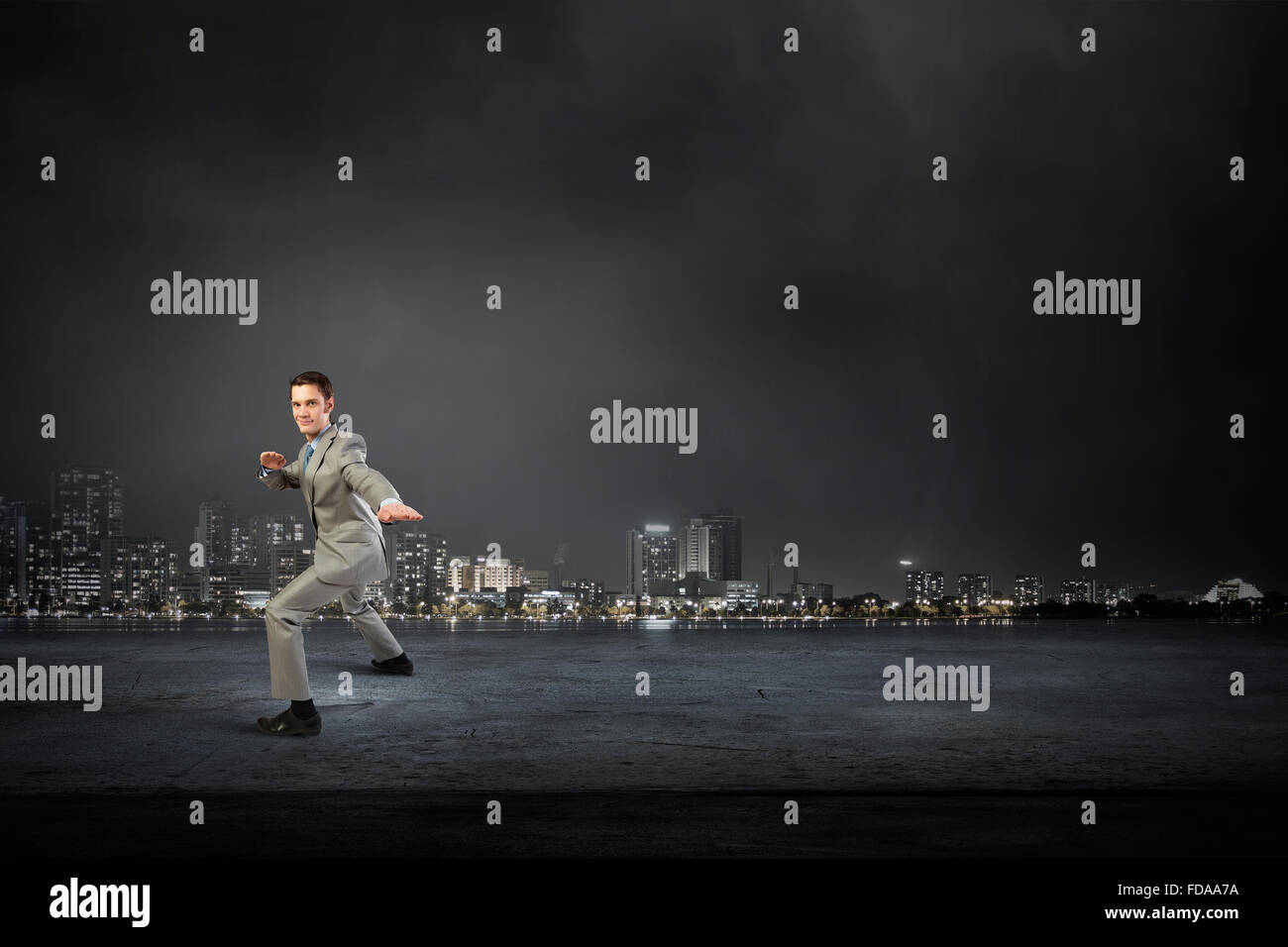 Positive young salesman demonstrating hi-res stock photography and ...