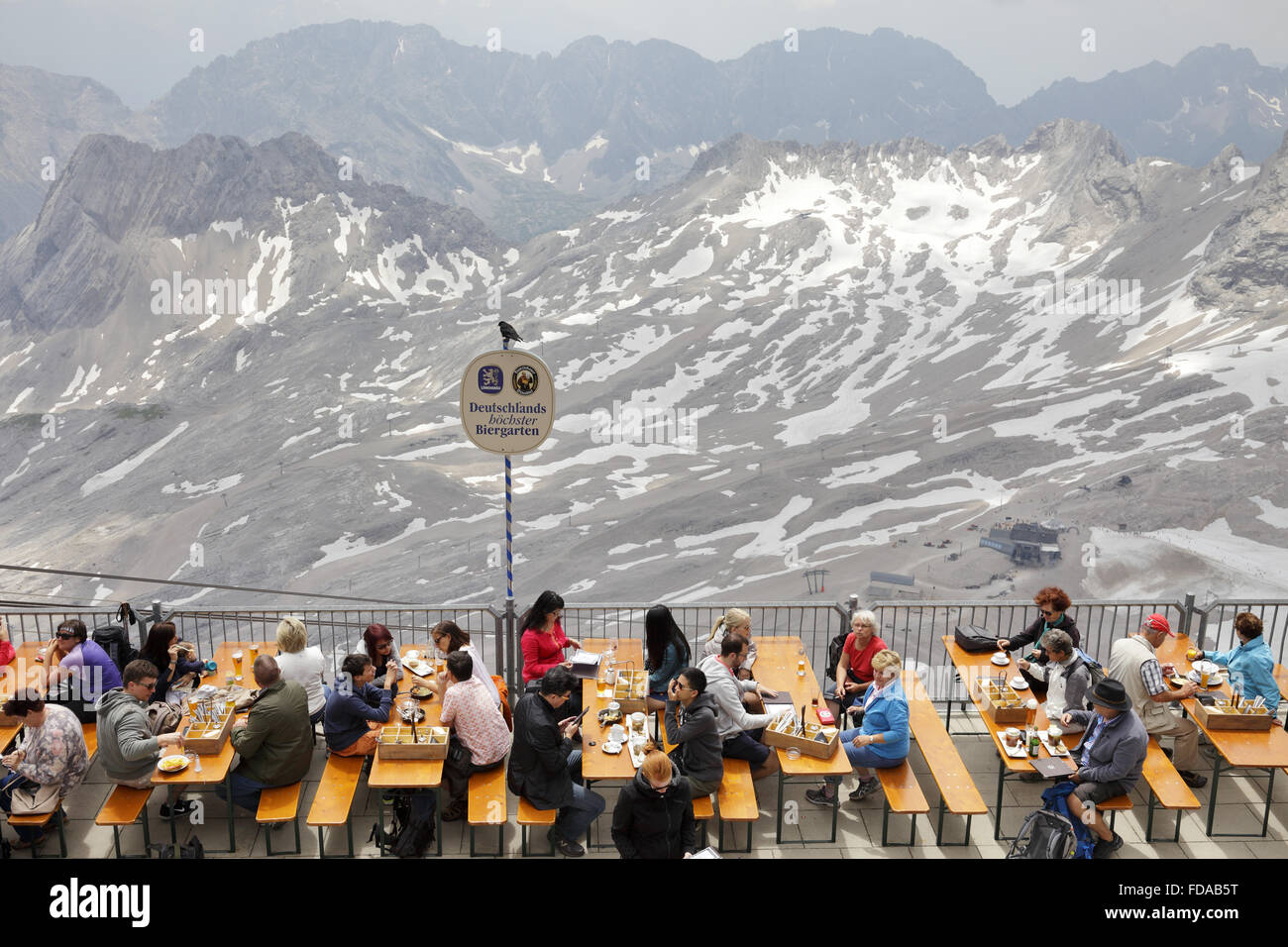 Zugspitze, Germany, Quests in Germany's highest beer garden on the Zugspitze Stock Photo
