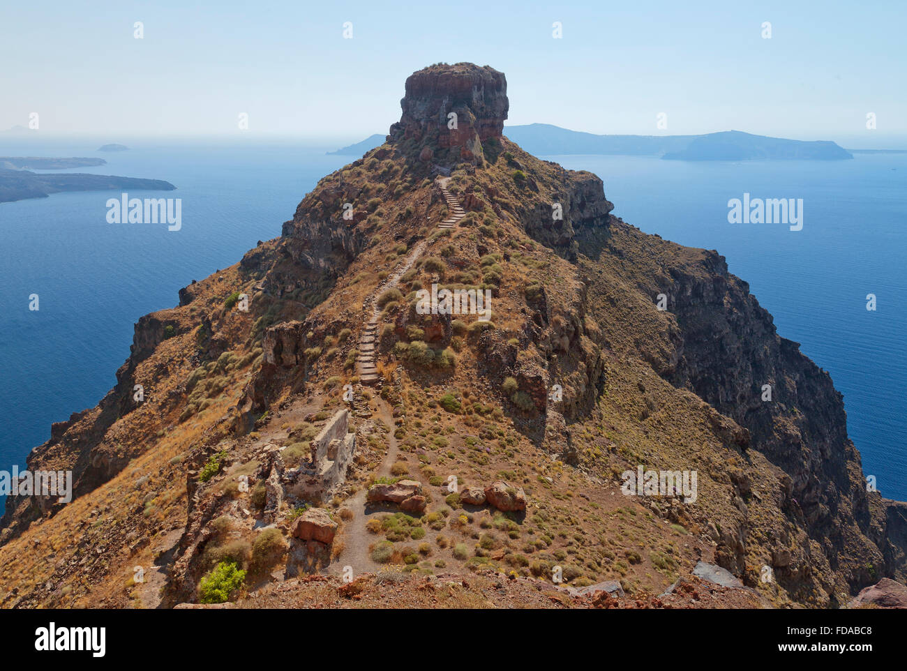 An image from Santorini overlooking the rock of skaros with the volcano in the background. Stock Photo